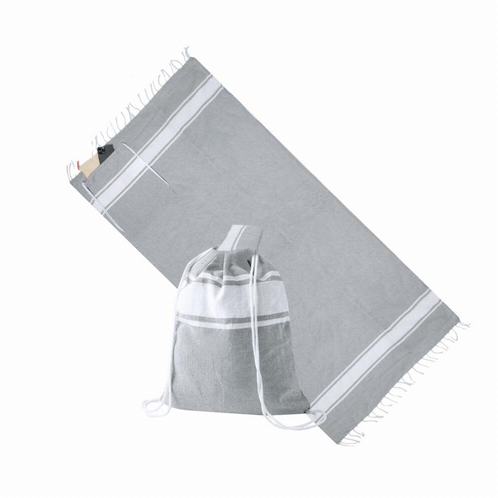 A grey towel with white stripes laid out alongside a matching drawstring bag. The towel features fringing on one edge. Carey - Image 1