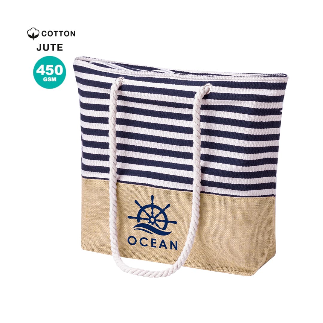 A striped navy and white tote bag with a jute bottom and a logo of a ship's wheel. It features rope handles. Ivyx Bag - Image 1