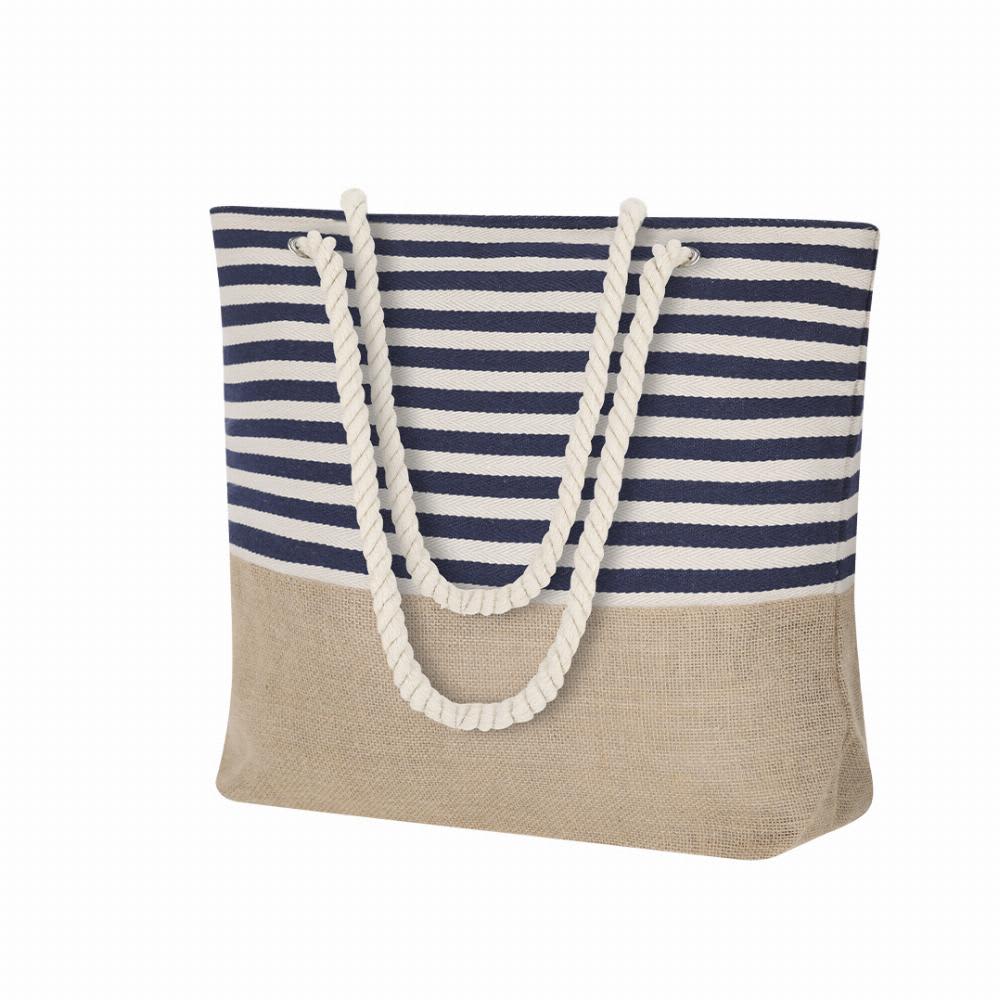 A bag featuring navy and white stripes on the top half and a natural jute bottom, with rope handles. Ivyx - Image 1