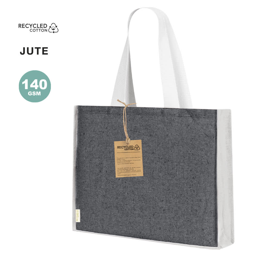 A grey jute tote bag with white handles, featuring a tag and a logo on the side. Talara Bag - Image 1