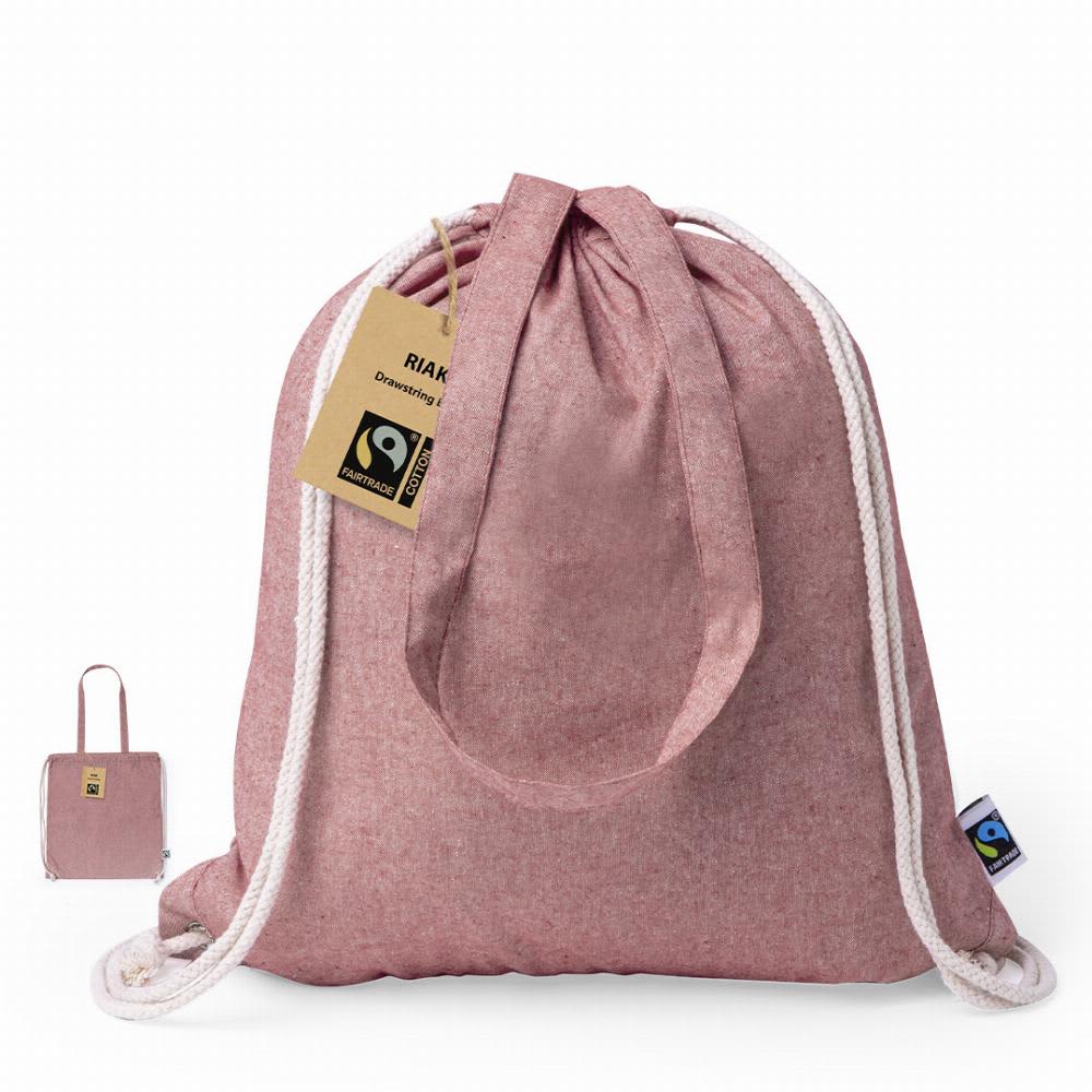 A drawstring bag in a soft pink shade with white ropes and a tag, featuring a logo. Riak Fairtrade - Image 1