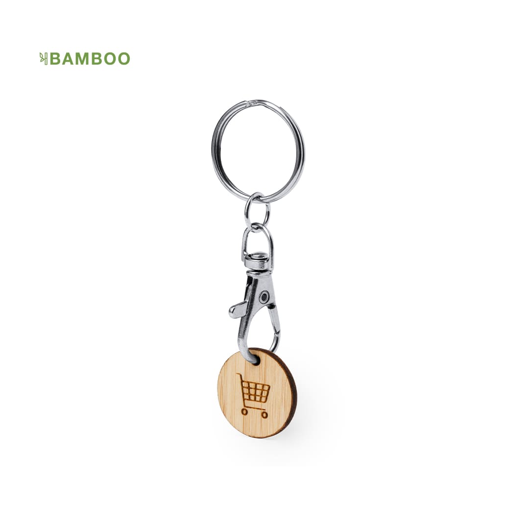 A bamboo keyring coin with a silver clip and circular design featuring a shopping cart motif. Inoki Keyring Coin - Image 1