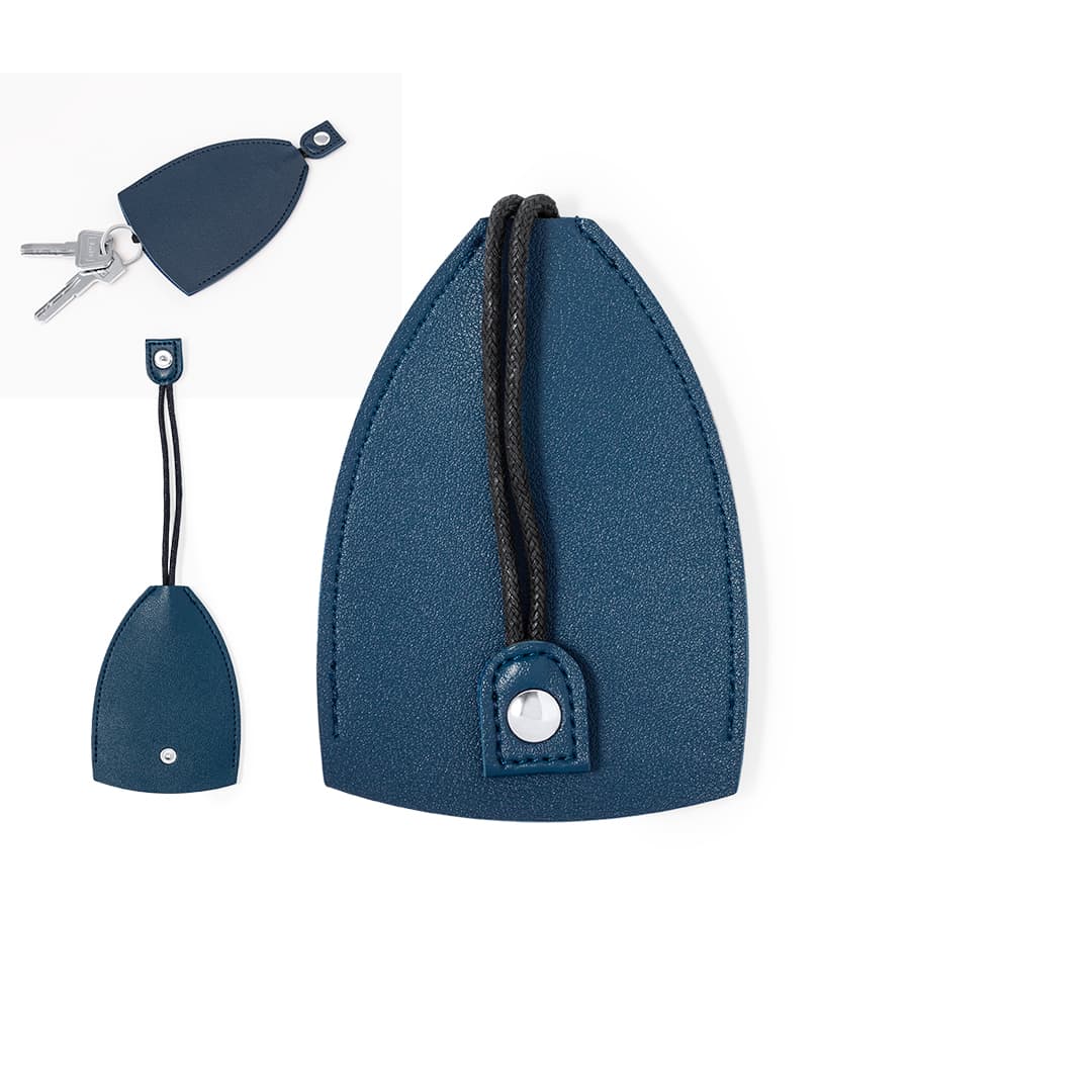 A navy blue accessory with a textured surface and a black cord, featuring a snap fastener and a logo. Greip Keyring - Image 1