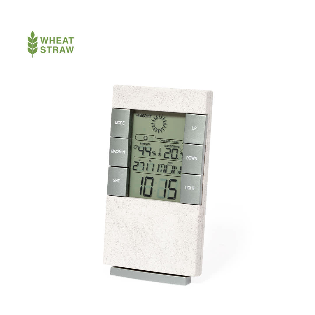 A weather station in a grey and white design with a digital display, featuring various buttons and a brand logo. Maginly Weather Station - Image 1