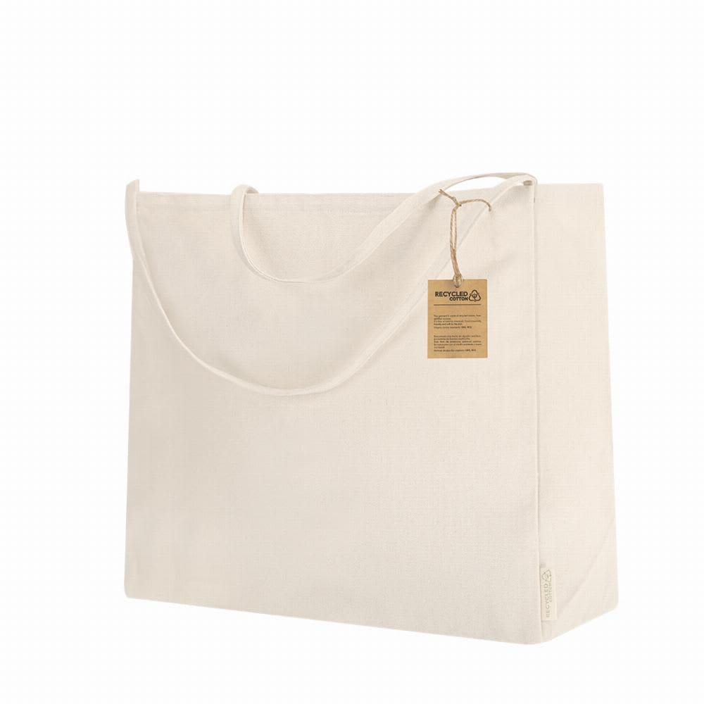 A tote bag in natural beige colour made from recycled materials, featuring handles and a tag. Yaponic - Image 1