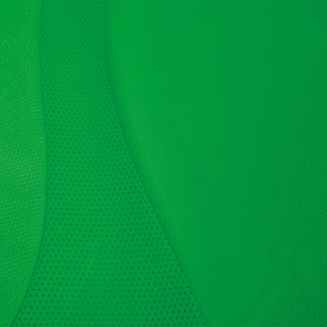 A green Tecnic Sappor Adult T-Shirt with a textured, breathable fabric design. It features a logo. Tecnic Sappor Adult T-Shirt - Image 1