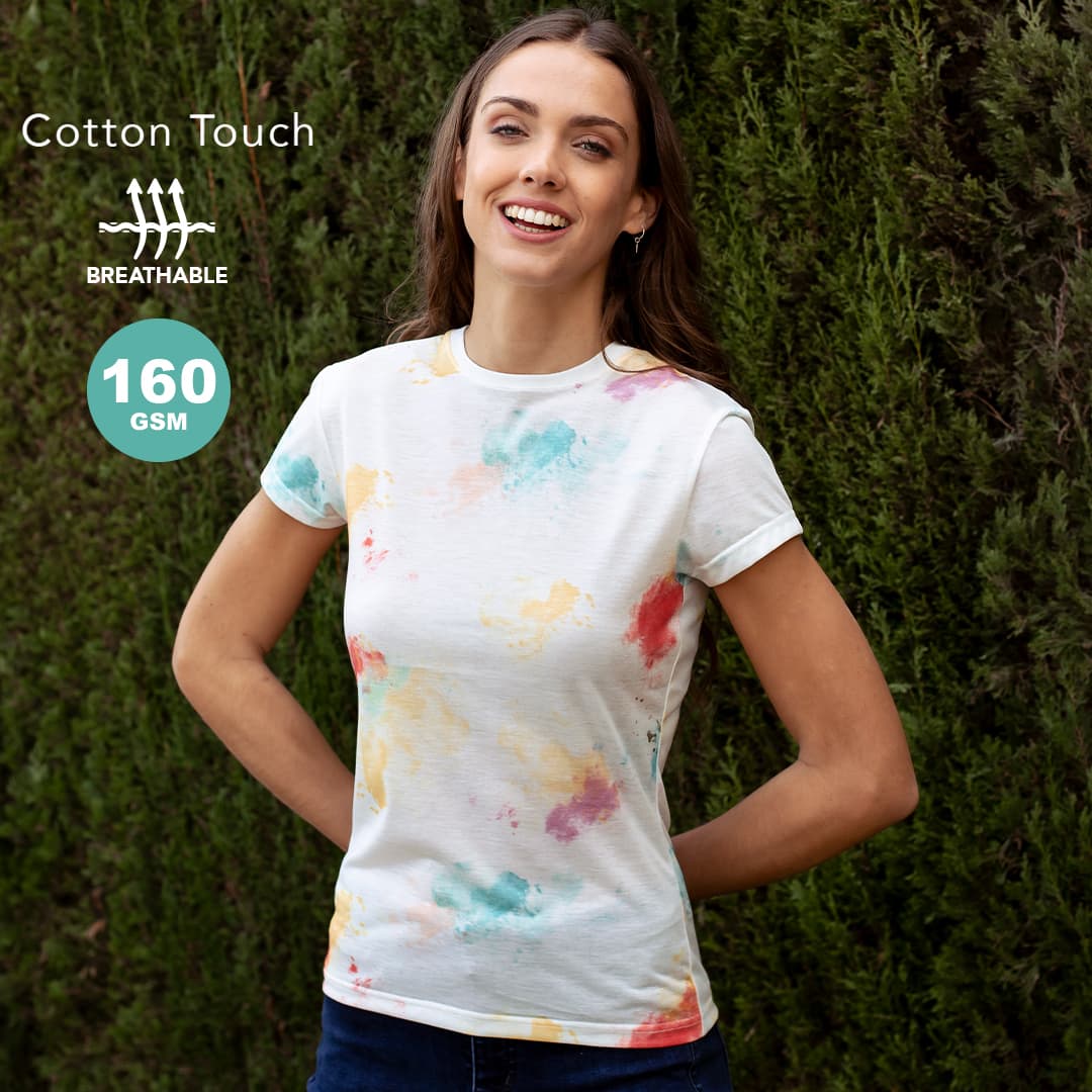 A woman wearing a short-sleeved, breathable T-shirt with a multicoloured paint splatter design against a green backdrop. Hearvin Women T-Shirt - Image 1
