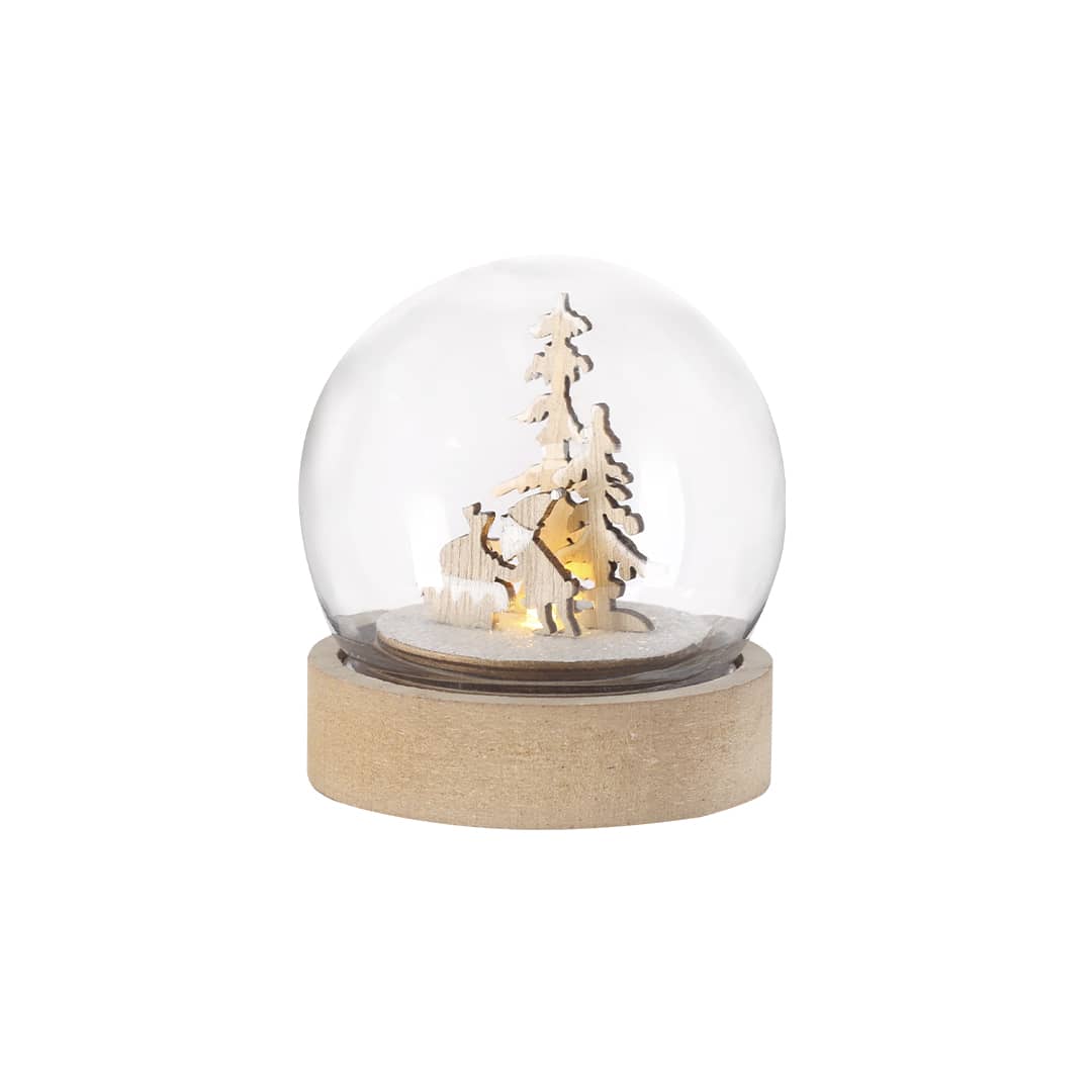 A decorative snow globe featuring wooden figures of trees and a person, illuminated with soft light and a wooden base. Cemayer Christmas Decoration - Image 1