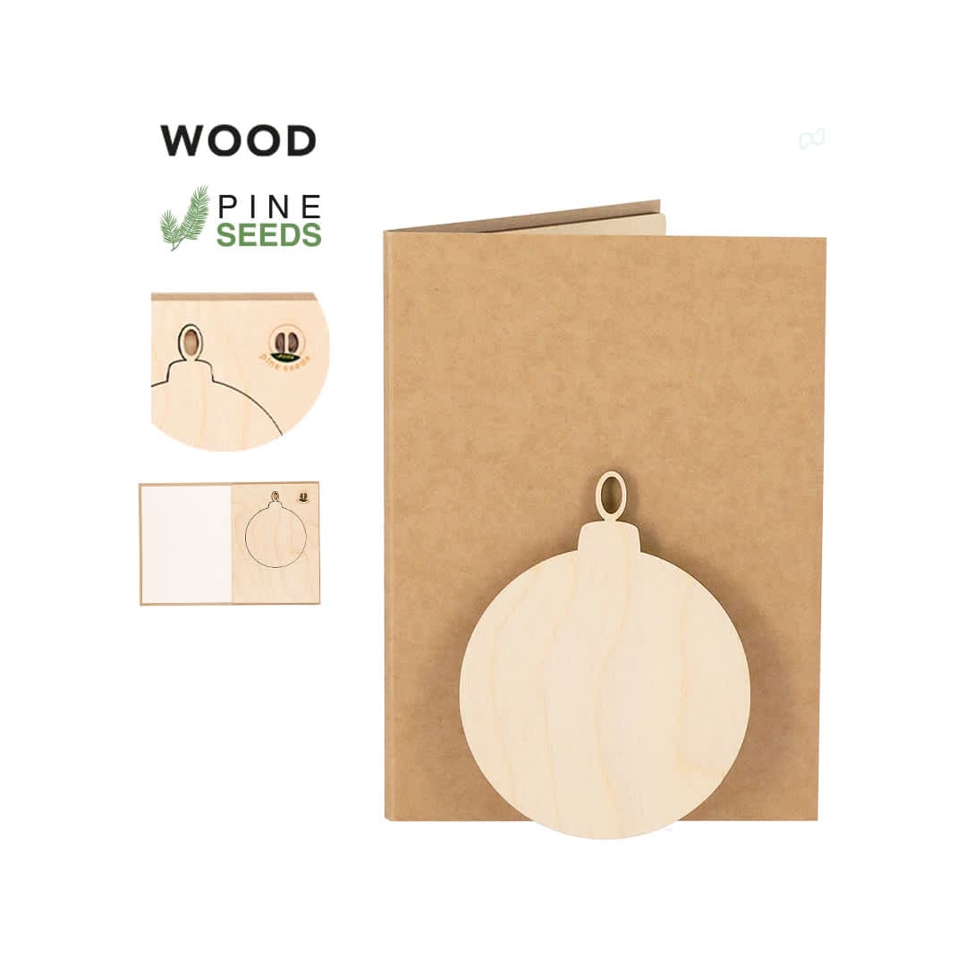 A wooden Christmas card decoration in a natural kraft envelope, featuring a circular ornament design and pine seeds. Astrox Christmas Card Decoration - Image 1