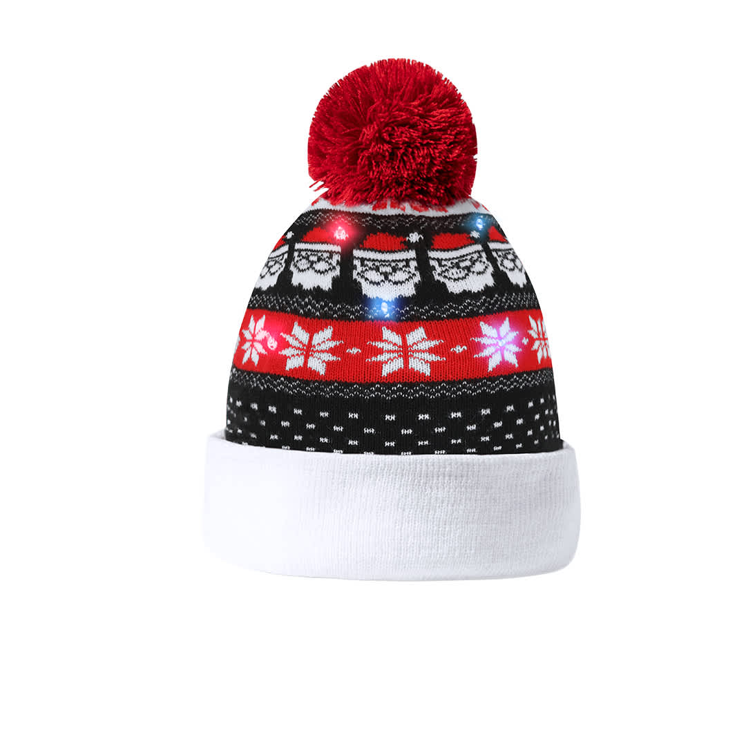 A beanie Christmas hat featuring red, black, and white with a festive pattern, pom-pom, and lights. Plumex Christmas Hat - Image 1