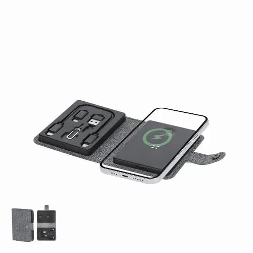 A portable charger in a grey case with charging cables included. The case has a logo and a wireless charging feature. Zakary - Image 1