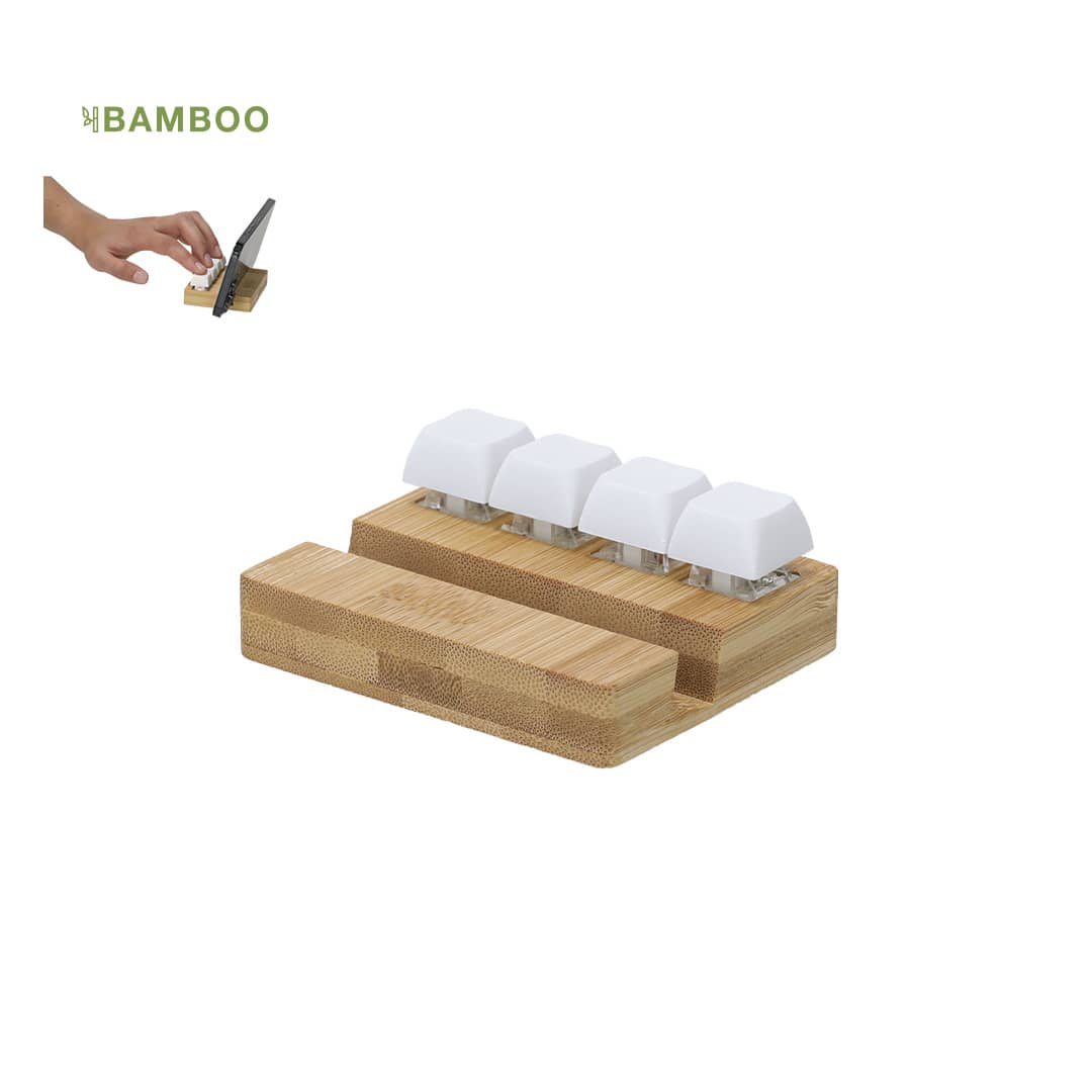 A bamboo phone stand with four white holders for devices, featuring a hand adjusting the phone's position. Terap Antistress Holder - Image 1