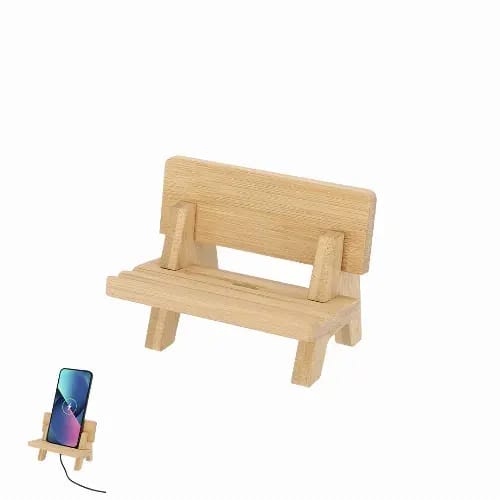 A phone stand made of light bamboo, designed like a small bench, featuring a slot for a mobile device. Hadam - Image 1