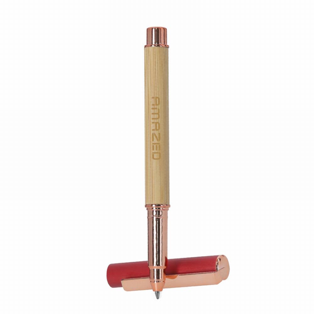 A pen with a bamboo barrel and rose gold accents, featuring a red cap and branding on the barrel. Bobbin - Image 1