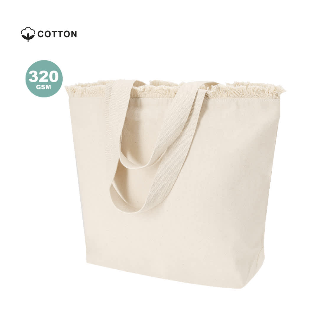 A cream tote bag with textured edges and sturdy handles, featuring a logo and made of 320 GSM cotton. Whistler Bag - Image 1