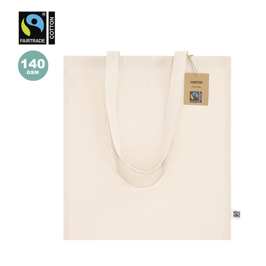 A cream tote bag with long handles and a tag, featuring a logo. Made from Fairtrade cotton, 140 GSM. Ginter Fairtrade Bag - Image 1