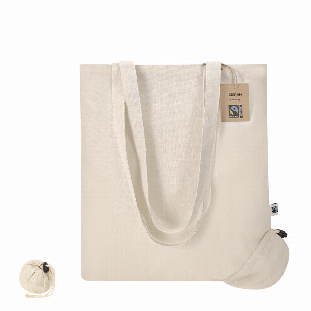 A cream-coloured tote bag with long handles and a drawstring pouch attached. It features a logo or branding. Kieran Fairtrade - Image 1