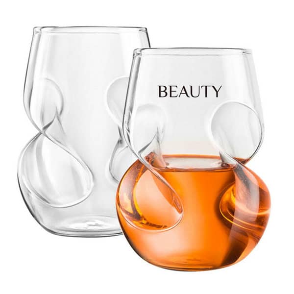 A set of two stemless wine glasses with fingerprint indentations, one clear and one filled with amber liquid. 16 oz. Finger Indentations Stemless Wine Glasses - Image 1