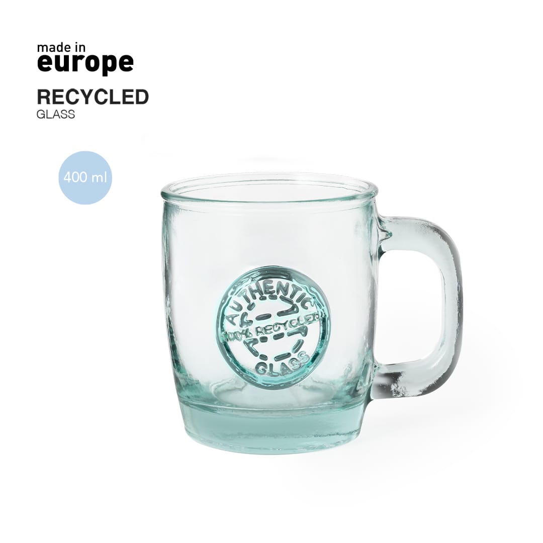 A drink mug made from recycled glass, featuring a handle and a light green tint. It has a circular emblem on the side. Chantir Mug - Image 1