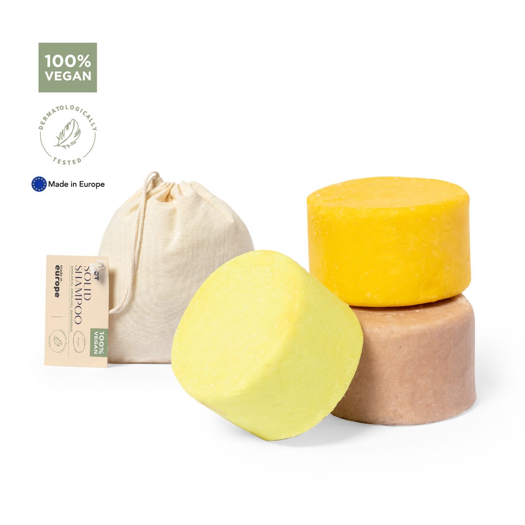 Three solid shampoo bars in yellow, beige, and light brown, accompanied by a natural fabric pouch. 100% vegan. Turuen Shampoo Set - Image 1
