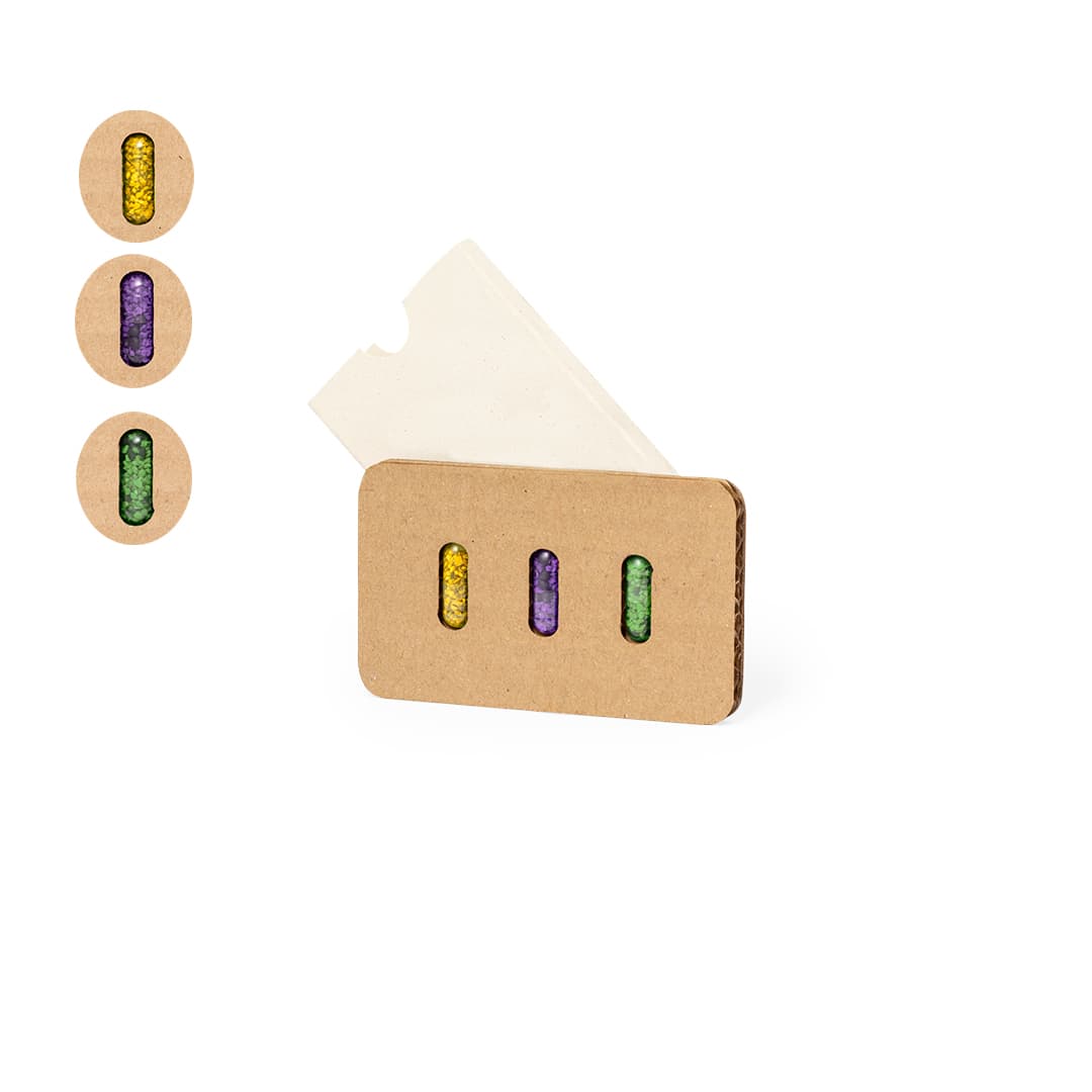 A set of three seed capsules in purple, green, and yellow, presented in a brown cardboard packaging with a logo. Nioxis Seed Capsules Set - Image 1