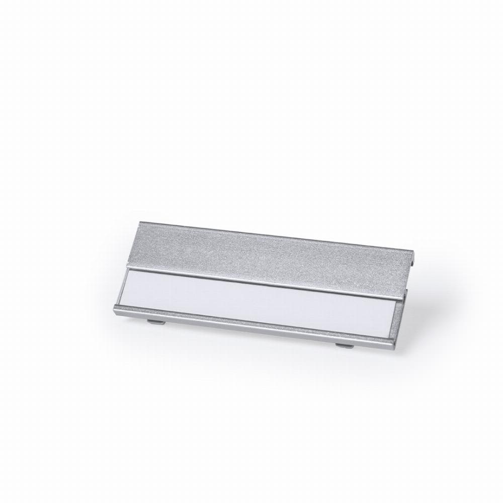 A silver promotional product with a blank white section and a sleek, metallic finish. Bindel - Image 1