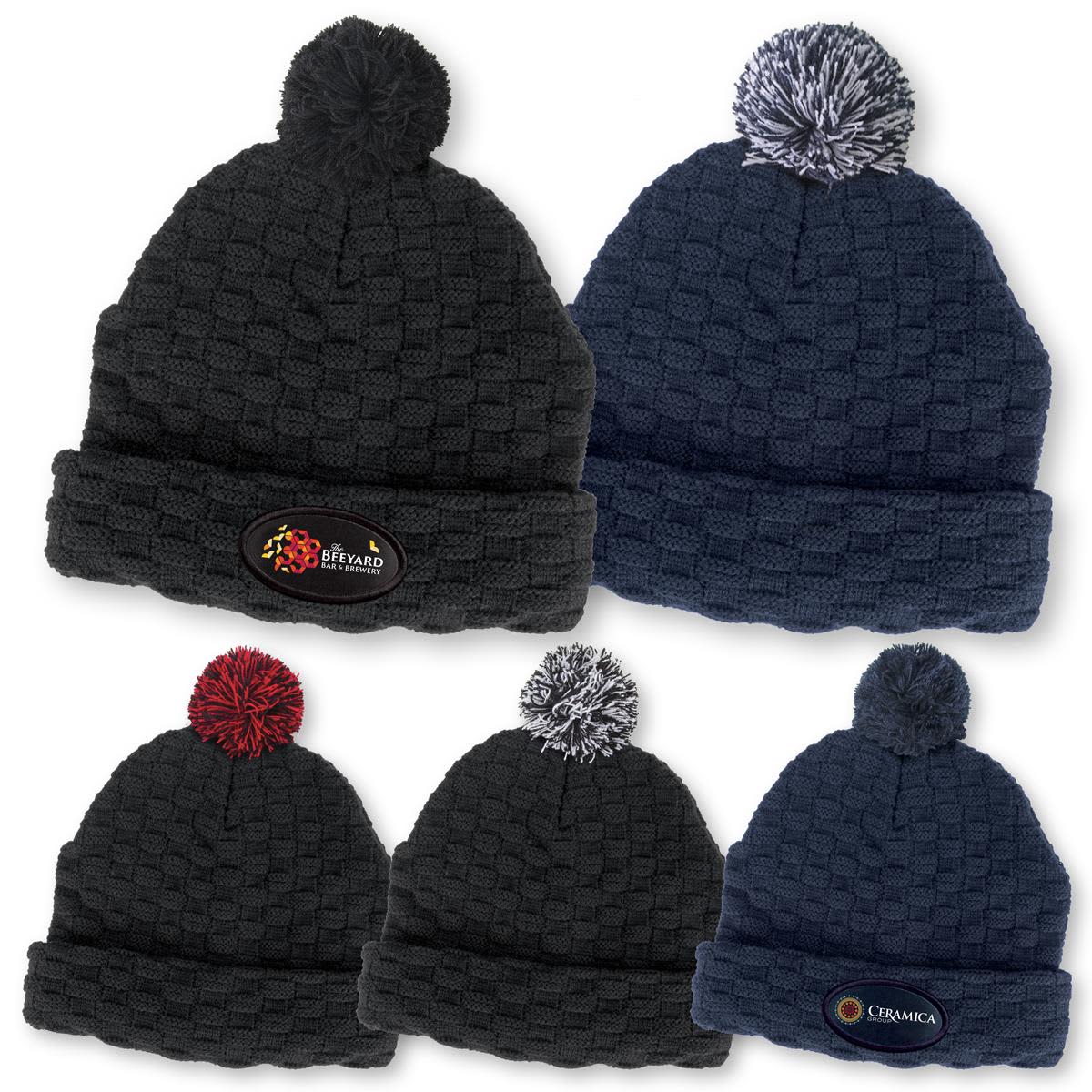 A collection of Pom Pom Beanies in navy and black, featuring a textured design and logos on the front. Pom Pom Beanie - Image 1