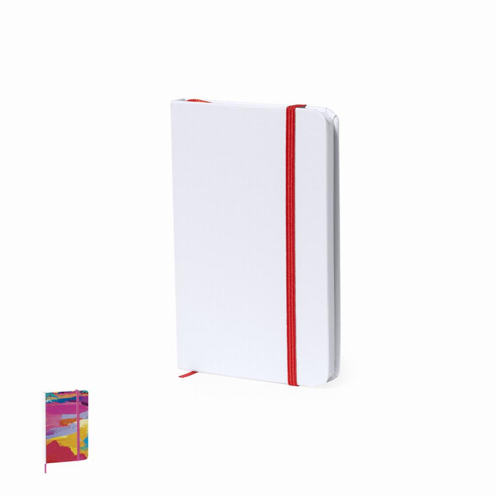 A notebook with a white cover features a red elastic band, with a colourful design on the lower left corner. Yakis - Image 1