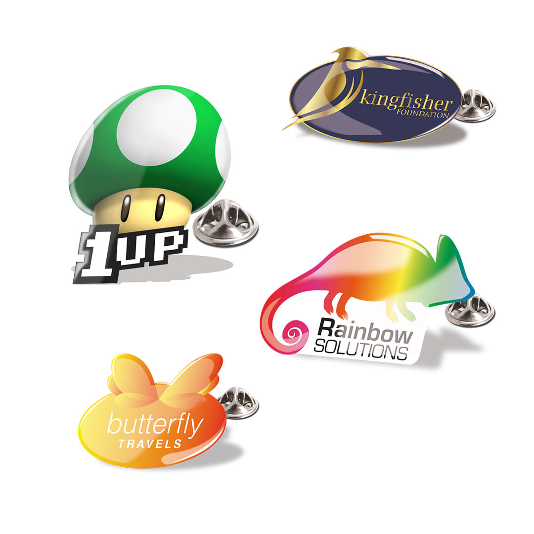 A collection of colourful lapel pins featuring a mushroom, chameleon, butterfly, and a logo with branding. Formix Pin - Image 1