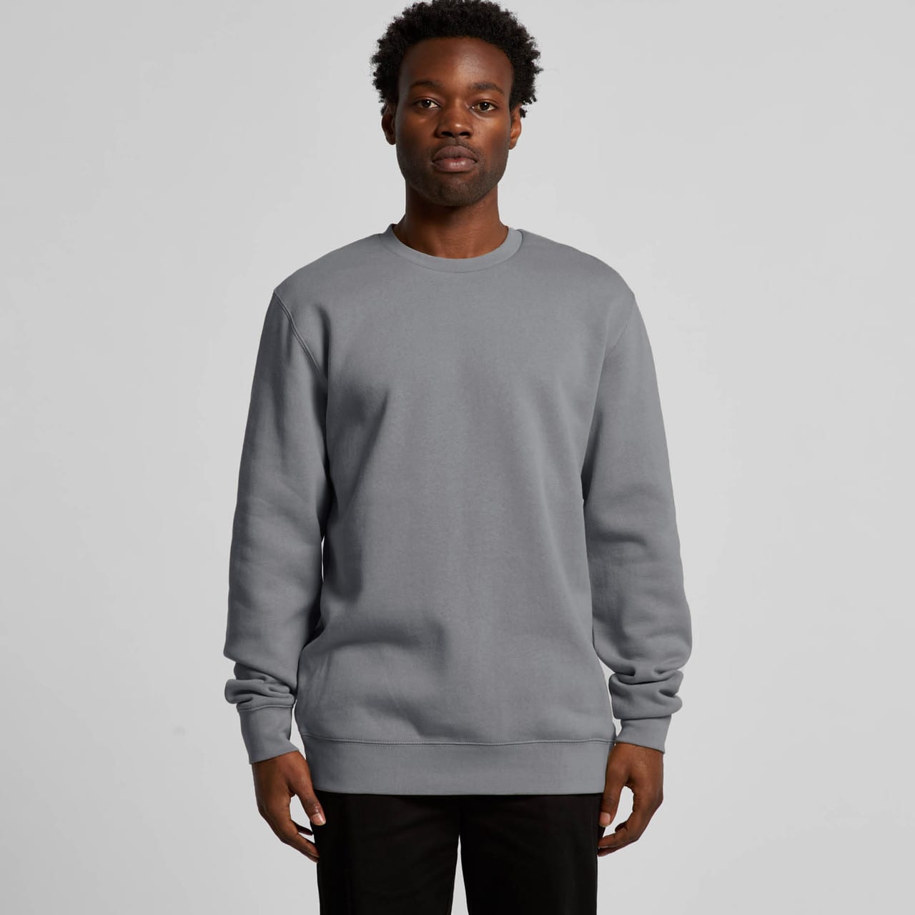 A grey hoodie with long sleeves and a round neckline, featuring a simple design and a logo. Stencil Crew - Image 1