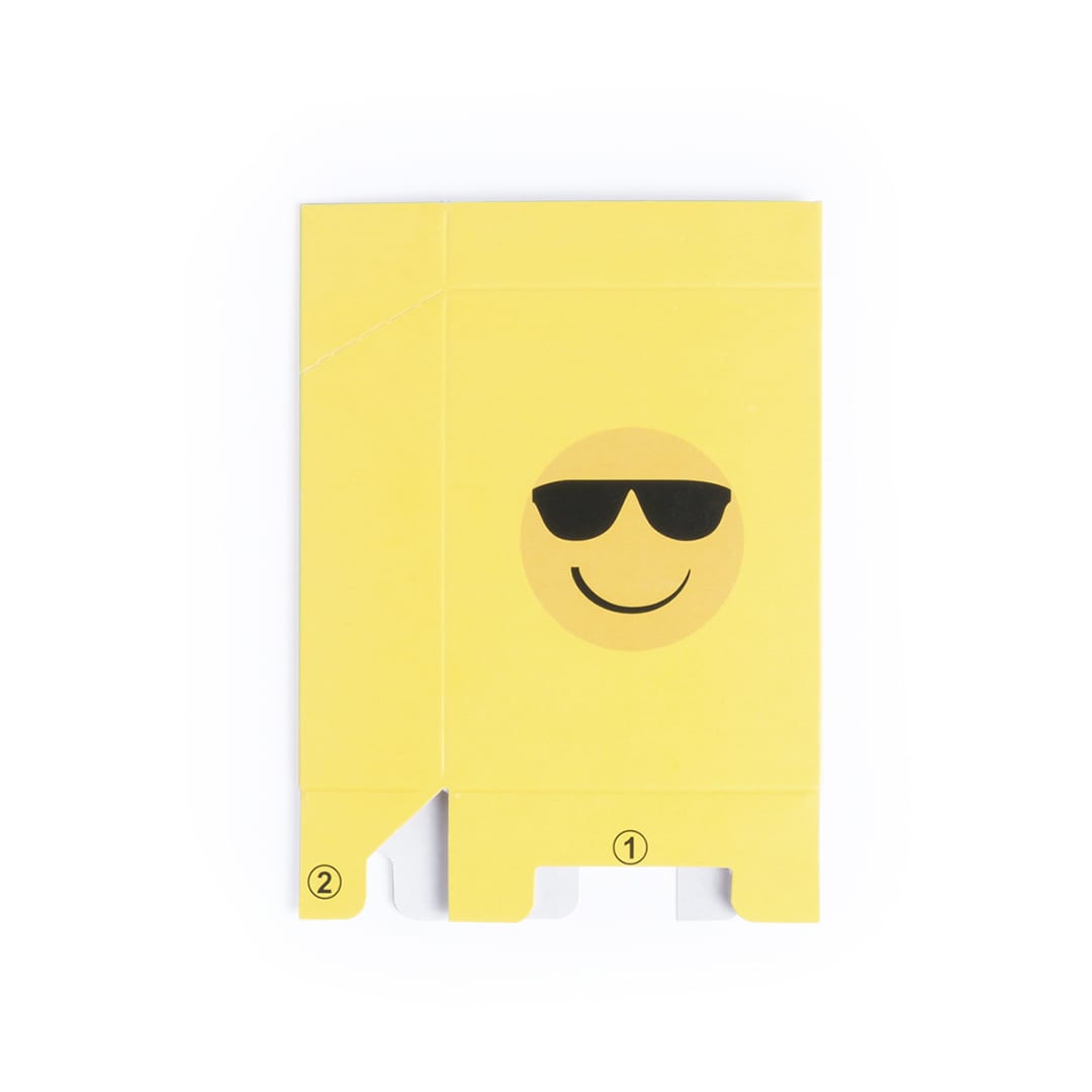 A yellow cigarette pack cover featuring a smiling emoji with sunglasses and a logo. Straik Cigarette Pack Cover - Image 1