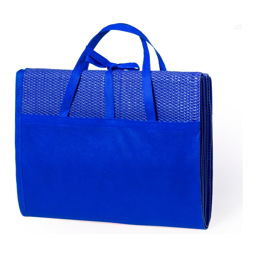 A blue beach mat with carrying handles and a textured surface, featuring a pocket on the front. Kassia Beach Mat - Image 1