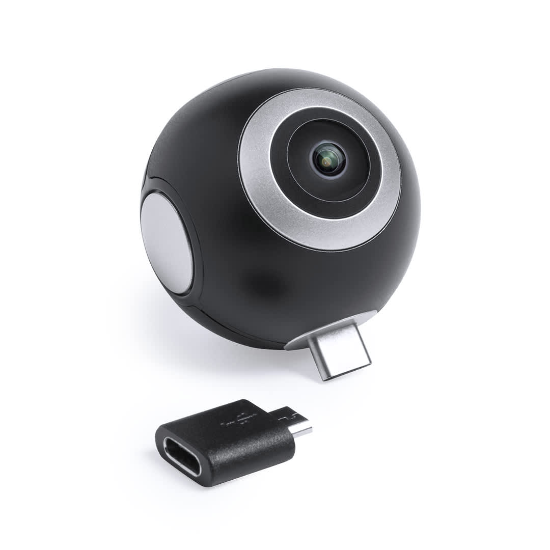 A round black camera featuring a lens and a USB connector, accompanied by a small adapter. Ribben 360° Camera - Image 1