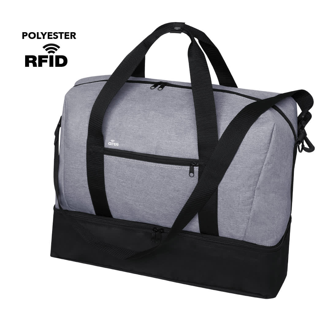A grey and black duffle bag with multiple straps and a front pocket, featuring a branding logo. Kanit Bag - Image 1