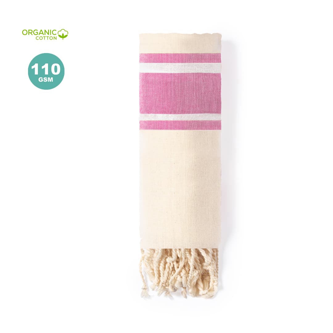 A rolled towel in cream with pink stripes, made from organic cotton. It features tasselled ends. Yistal Towel Pareo - Image 1