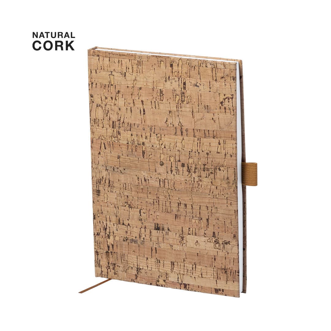 A cork notepad with a textured natural finish, featuring a brown strap and an elastic closure. Coquel Notepad - Image 1