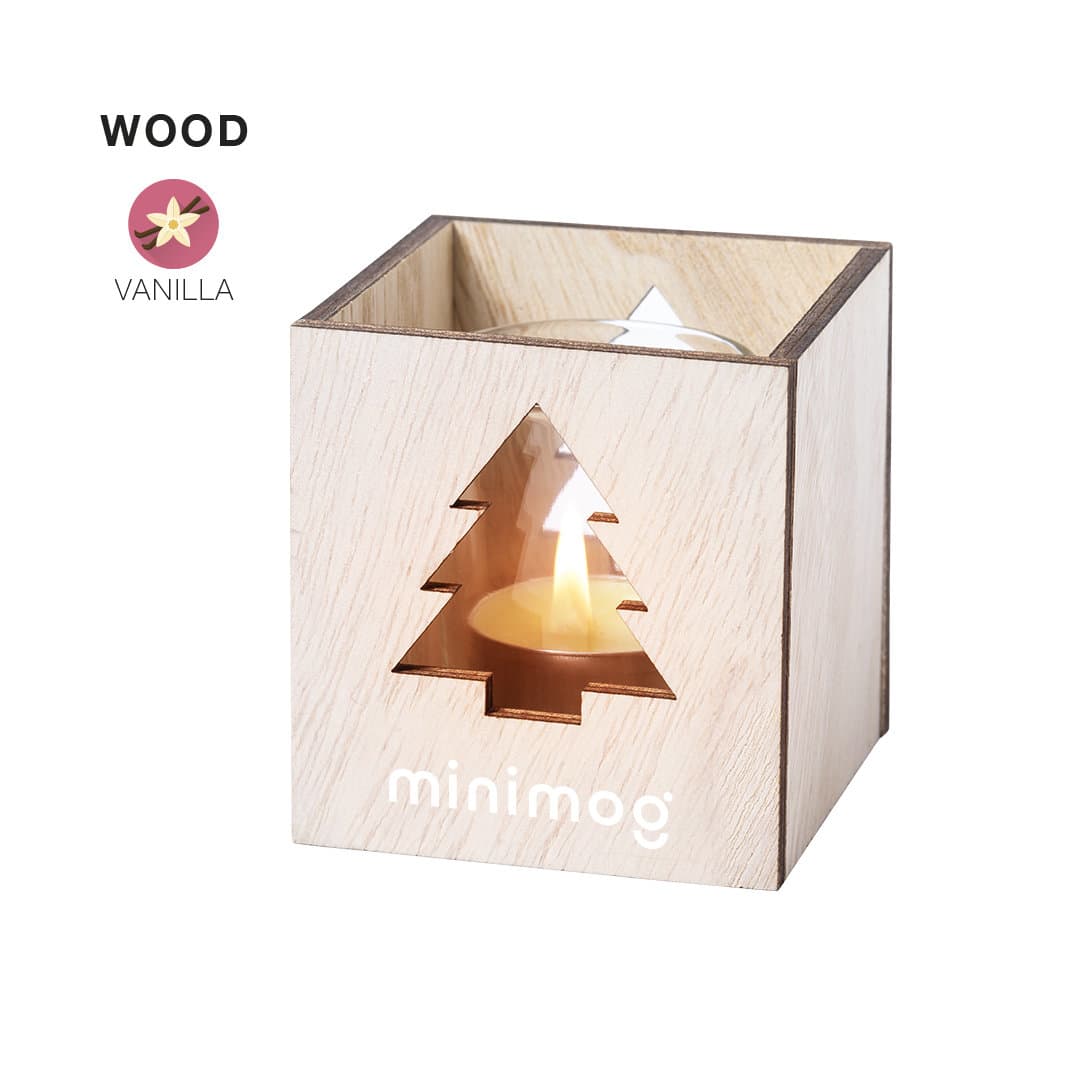 A wooden candle holder with a Christmas tree cut-out, featuring a vanilla-scented candle inside. Keylax Aromatic Candle - Image 1