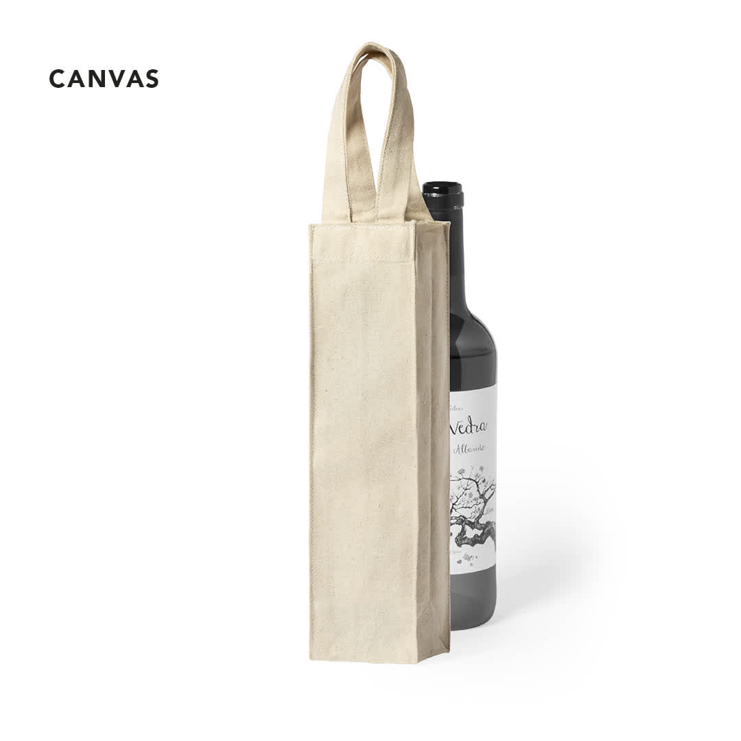 A cream-coloured tote bag with two handles, designed to hold a drink bottle, alongside a wine bottle. Yaiza Bag - Image 1