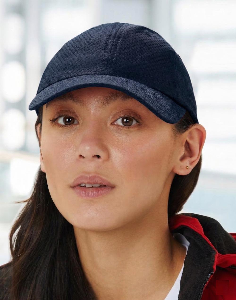 A white athletic mesh cap featuring a rounded crown and a stiff peak, complete with a logo. Athletic Mesh Cap - Image 1