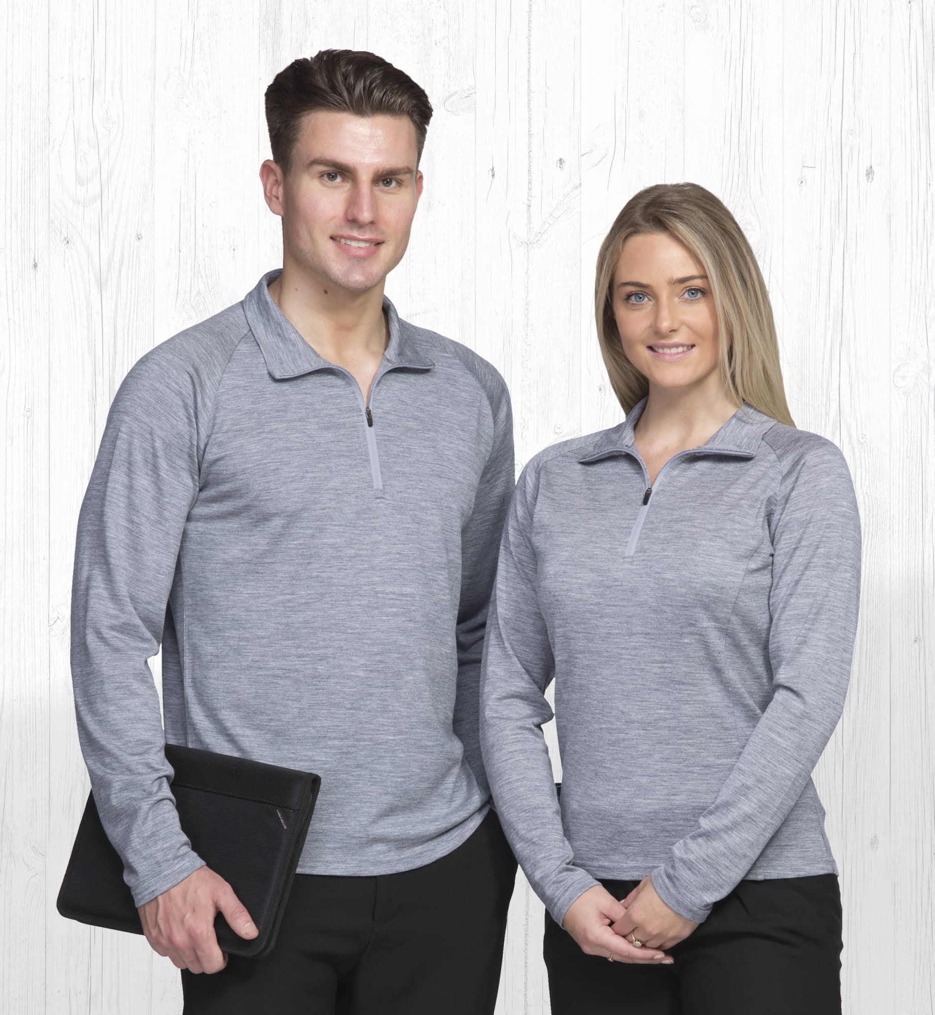 A grey Merino zip pullover for men and women, featuring a zip neck and long sleeves. The image includes a logo. Merino Zip Pullover - Mens - Image 1