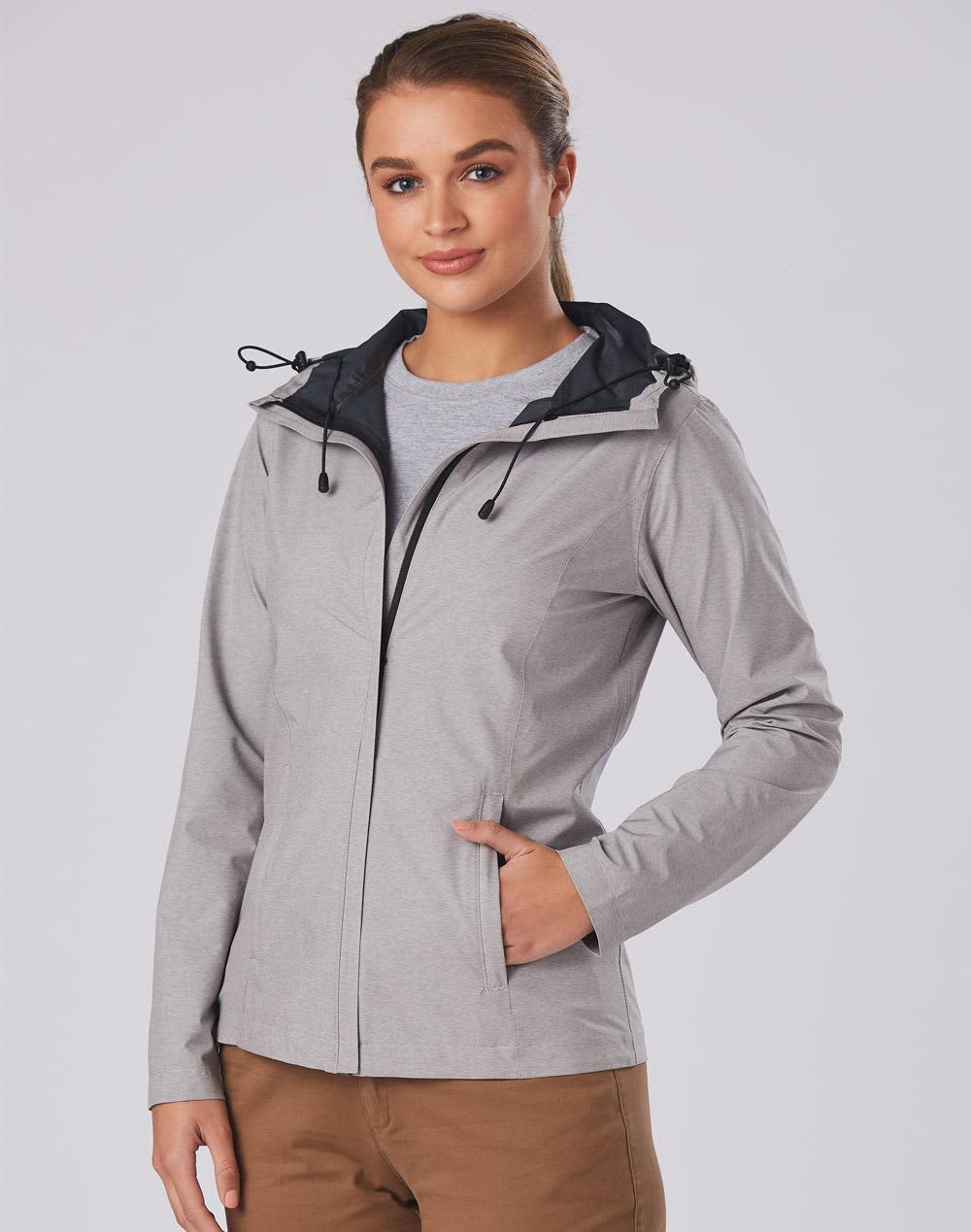 A waterproof performance jacket in light grey with a black hood and adjustable features. It has a subtle logo. Ladies' Waterproof Performance Jacket - Image 1
