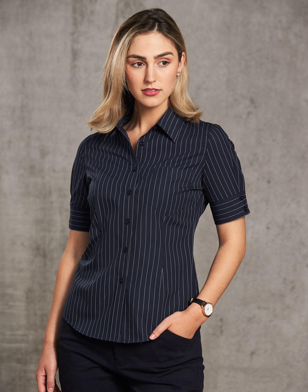 A women's short sleeve shirt in navy with a pin stripe pattern, featuring a button-up design and a logo. Women's Pin Stripe Short Sleeve Shirt - Image 1
