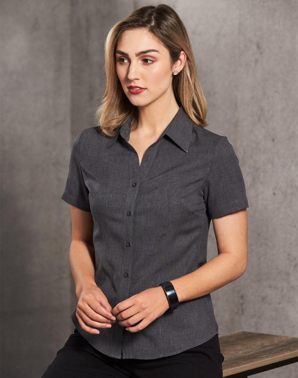 A women's short sleeve shirt in dark grey with a button-up front and collar, featuring a logo. Women's Cooldry Short Sleeve Shirt - Image 1
