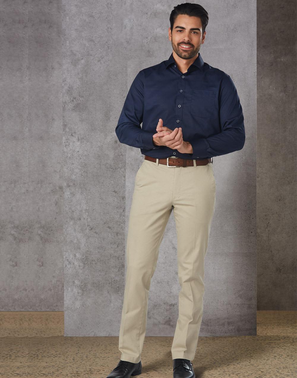 Men's chino pants in a light beige colour, displayed with a navy button-up shirt and brown belt. Features branding on the waistband. Men's Chino Pants - Image 1