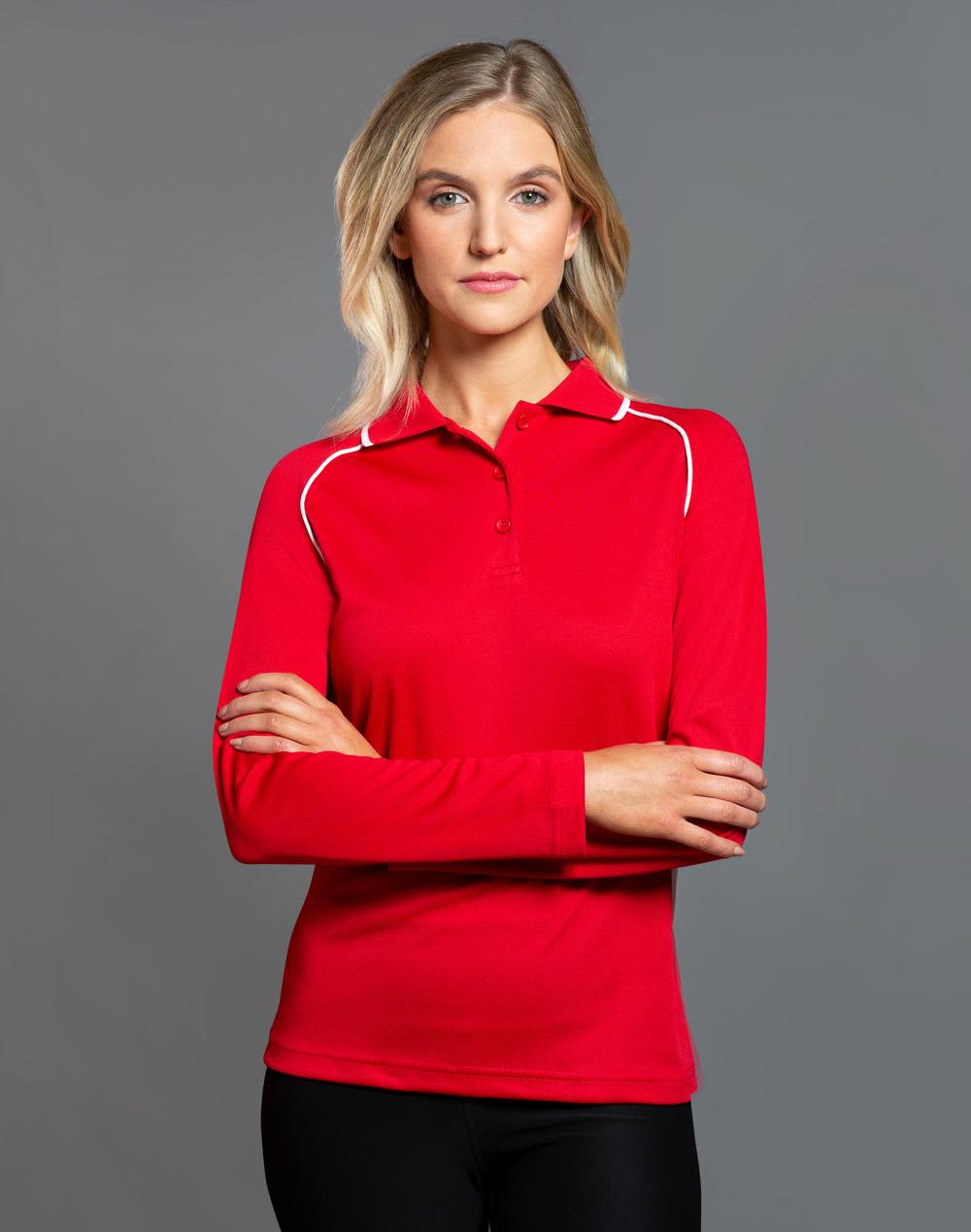 A red long-sleeve polo shirt with a white trim and a logo on the chest area. Ladies' cooldry raglan L/S polo - Image 1