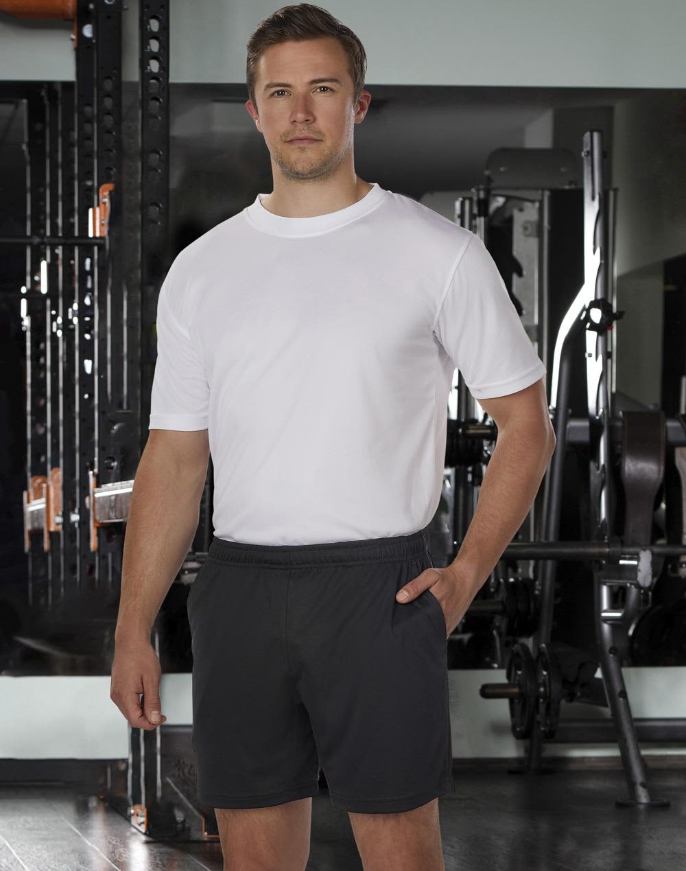 Adults' bamboo charcoal sports shorts in black, featuring an elastic waistband and side pockets. Model wearing a white shirt. Adults' Bamboo Charcoal Sports Shorts - Image 1