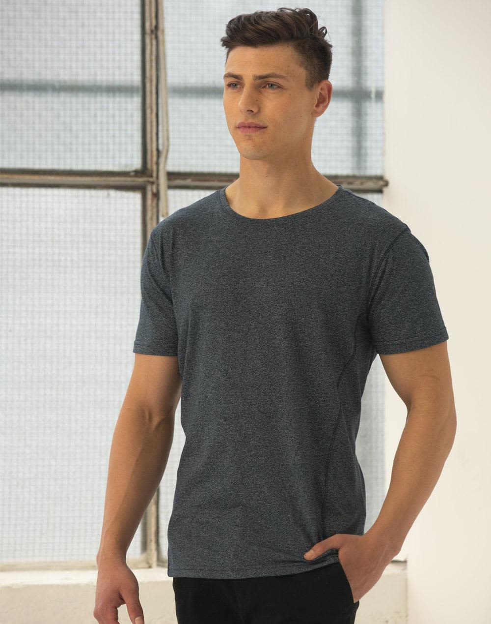 A model wearing a blue heather short-sleeve t-shirt with a relaxed fit, featuring a visible logo. Men's Cool Heather S/S Tee - Image 1