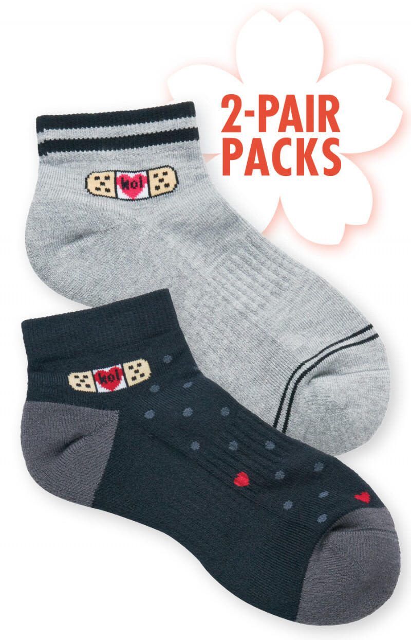A pair of compression ankle socks, one in grey and the other in navy with polka dots, featuring a logo. Compression Ankle Socks (2 pack) - Image 1