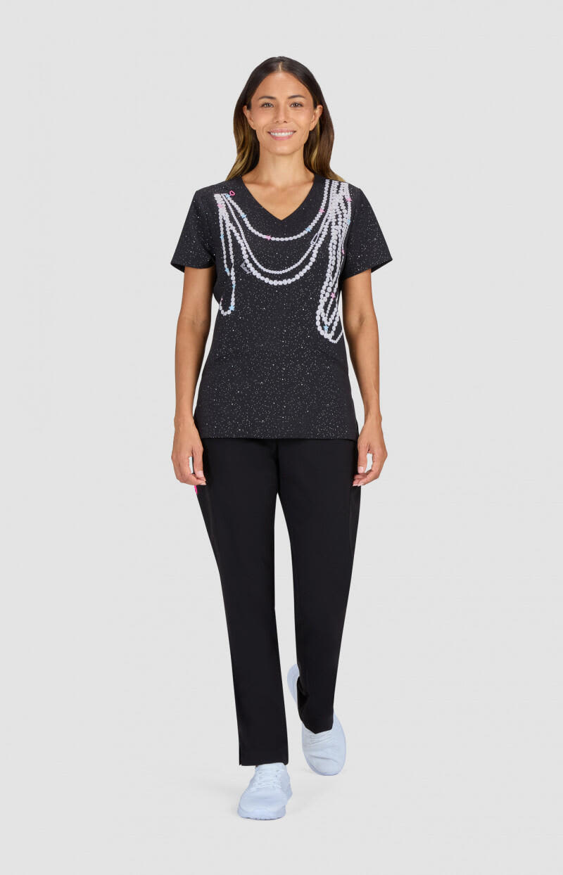 A black t-shirt with a decorative design featuring white chains, paired with black trousers and light blue shoes. Daffodil Top - Image 1