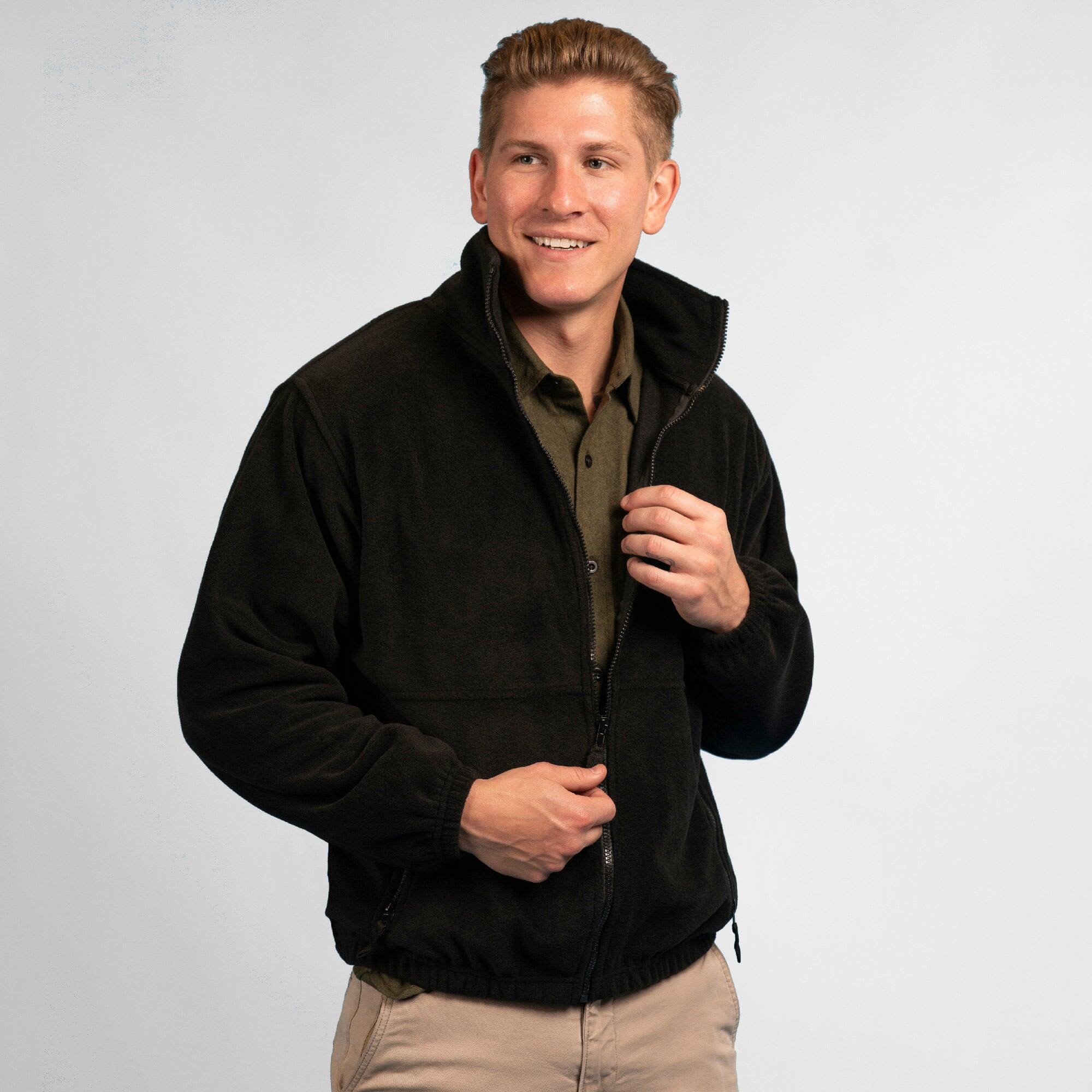 A black full zip polar fleece jacket worn by a smiling man, featuring a collar and zipped pockets. Full Zip Polar Fleece Jacket - Image 1